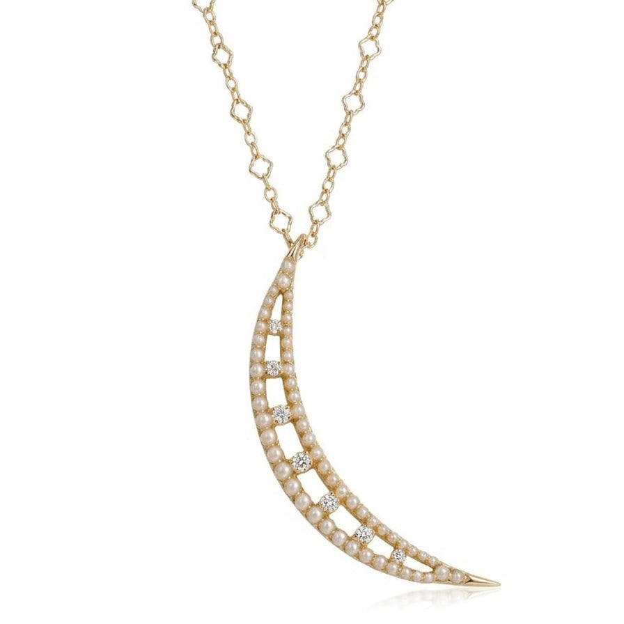 Delicate gold necklace with a crescent moon pendant on a white background